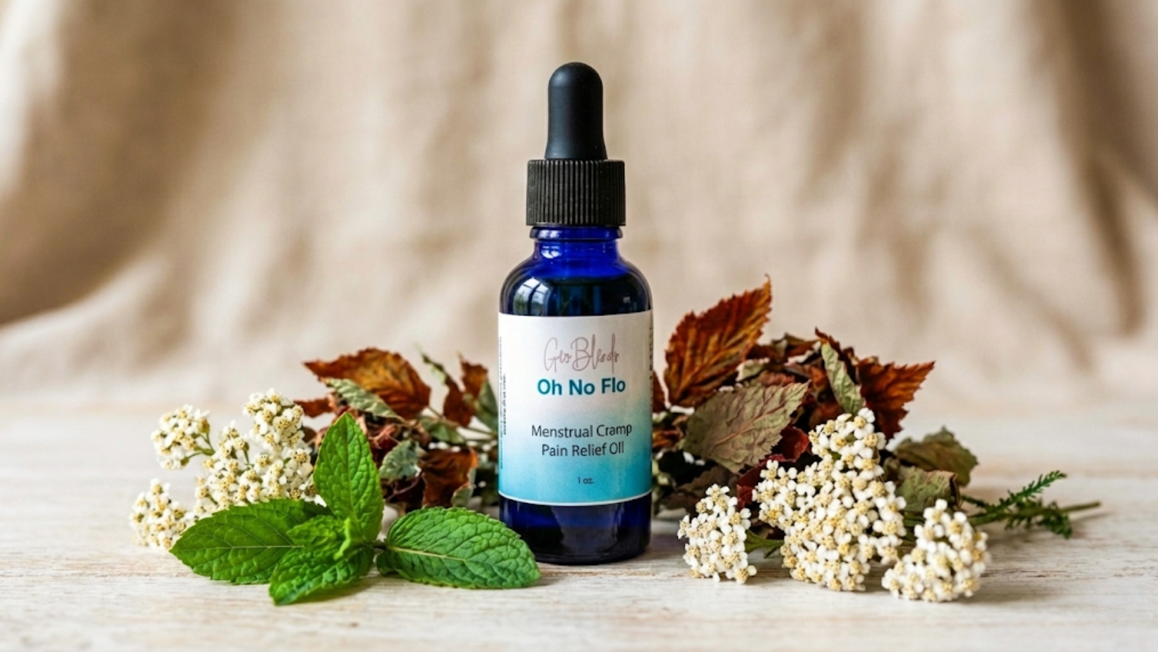 Oh No Flo menstrual cramp relief oil shown with herbal ingredients used in the formula