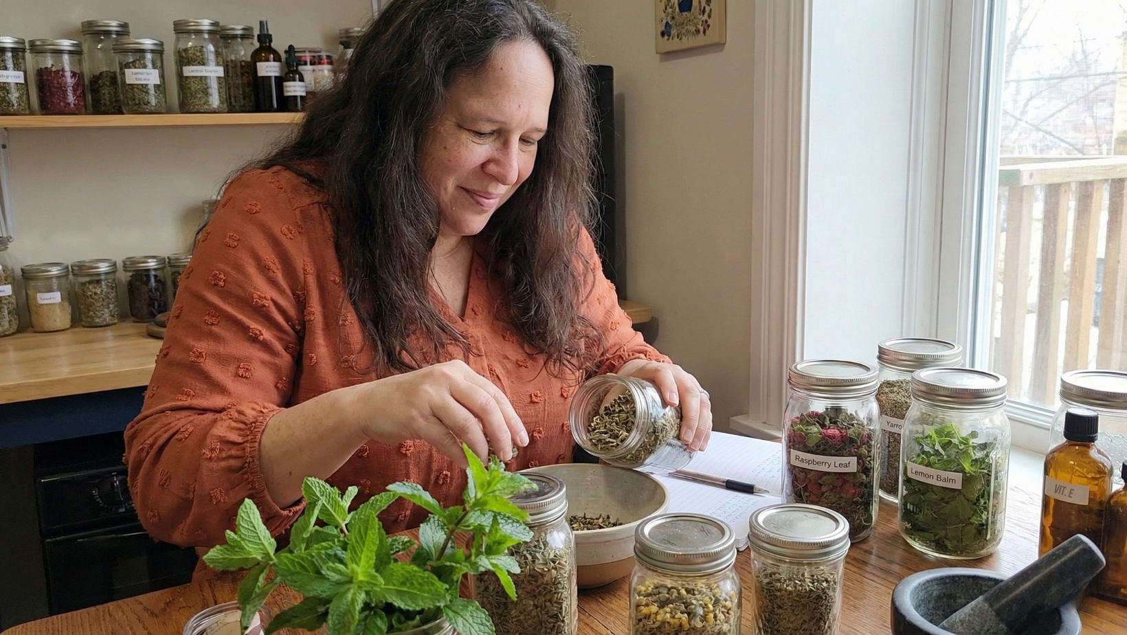 Brenda Deming making small-batch herbal oil