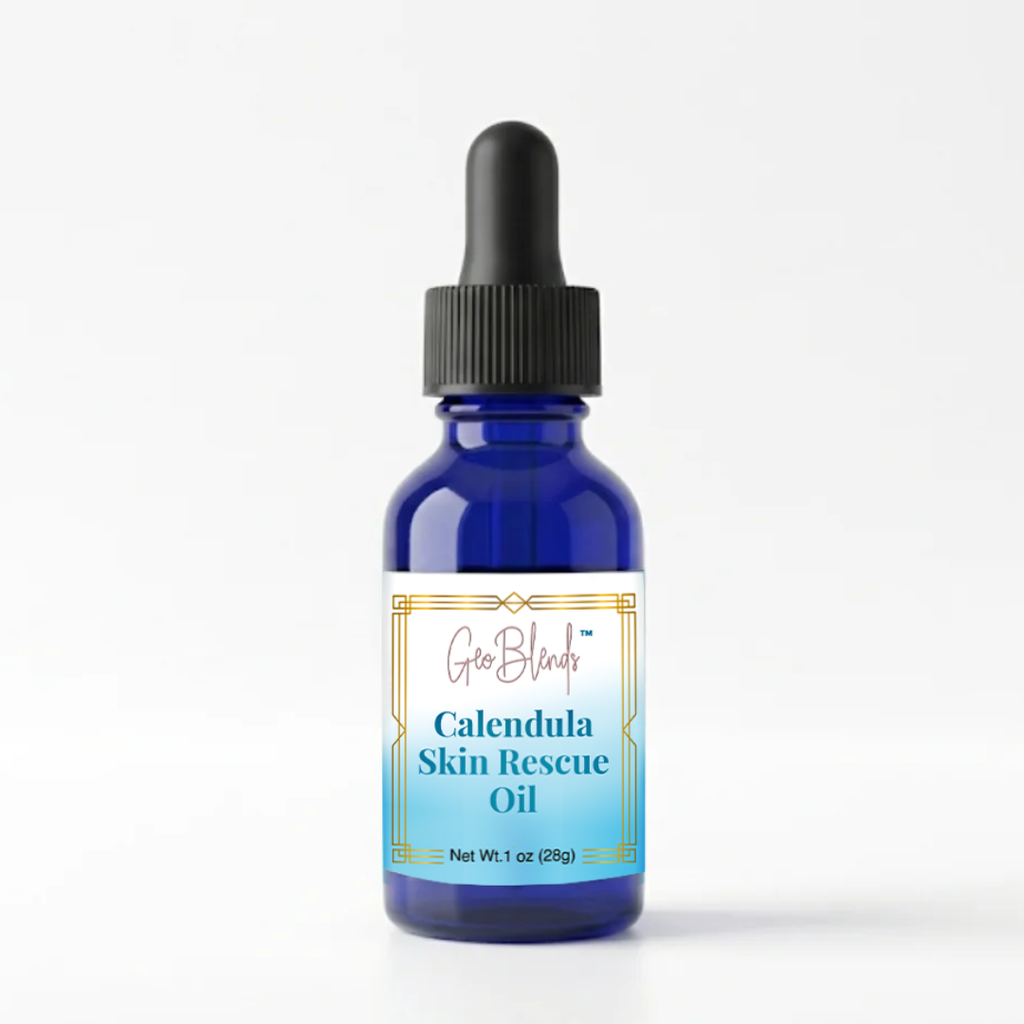 Blue bottle of Calendula Skin Rescue Oil with dropper on a white background